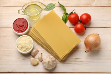 Photo of Ingredients for lasagna on white wooden table, flat lay