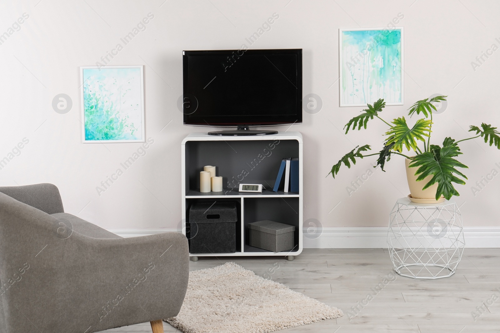 Photo of Modern TV set in living room interior