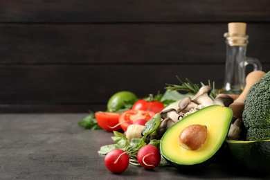 Photo of Fresh products on grey table, space for text. Healthy cooking