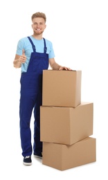 Photo of Portrait of moving service employee with cardboard boxes on white background