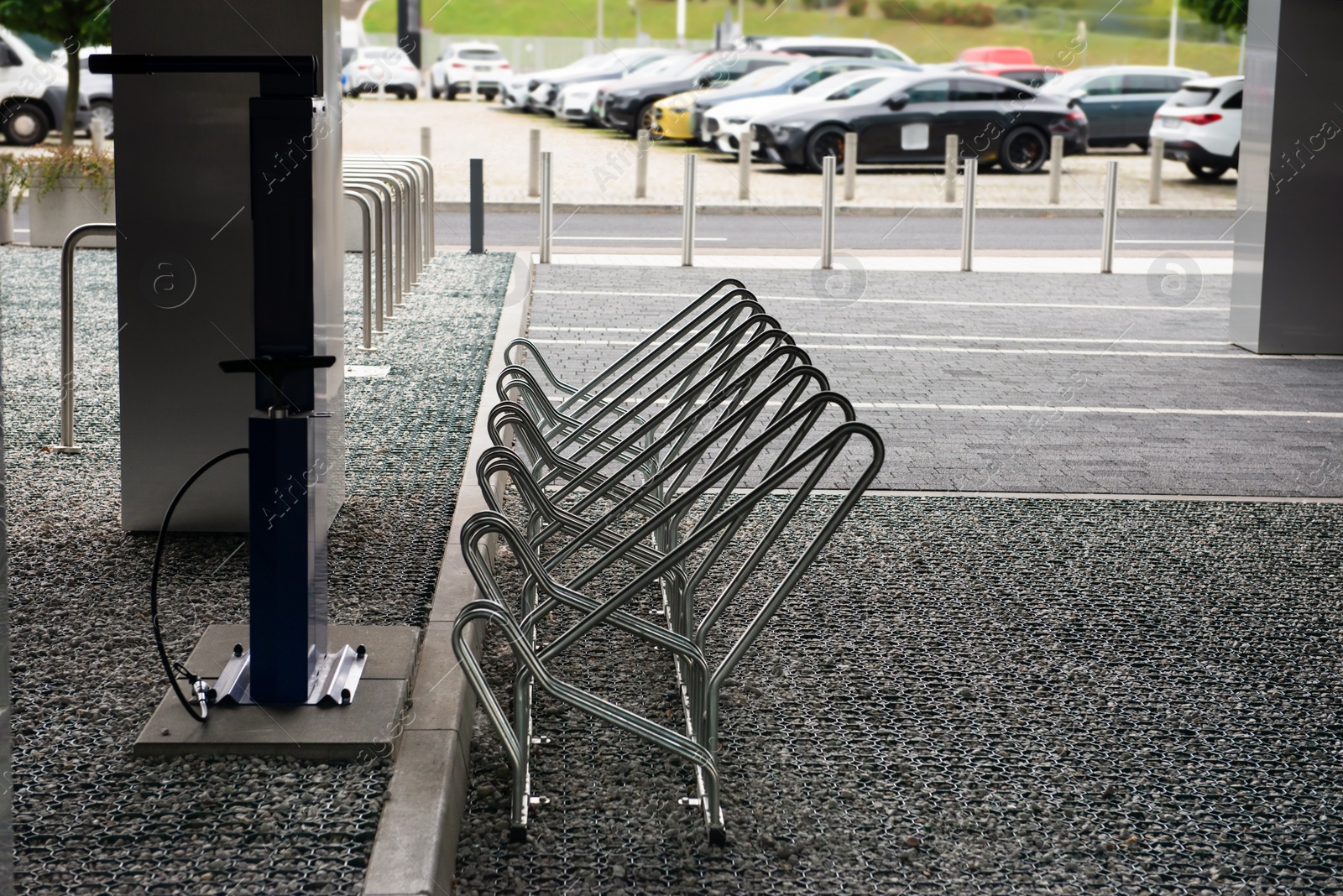 Photo of Empty metal parking rack for bicycles outdoors