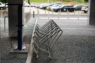 Photo of Empty metal parking rack for bicycles outdoors