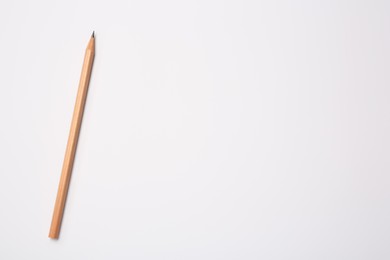 Photo of Sharp graphite pencil on white background, top view. Space for text