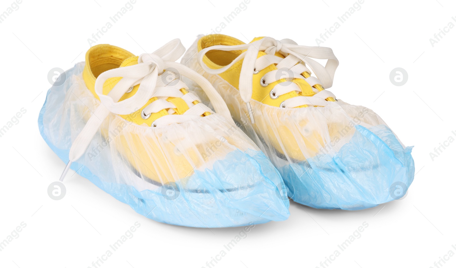 Photo of Sneakers in blue shoe covers isolated on white