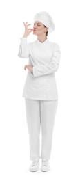 Photo of Chef in uniform showing perfect sign on white background