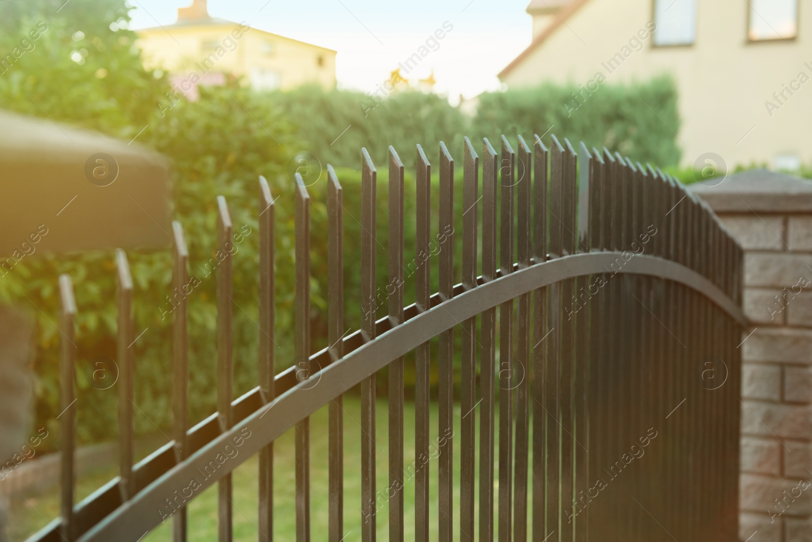 Photo of Iron railing of beautiful fence outdoors, closeup