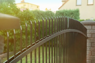 Photo of Iron railing of beautiful fence outdoors, closeup