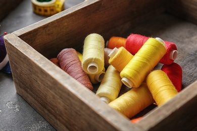 Box with color sewing threads, closeup