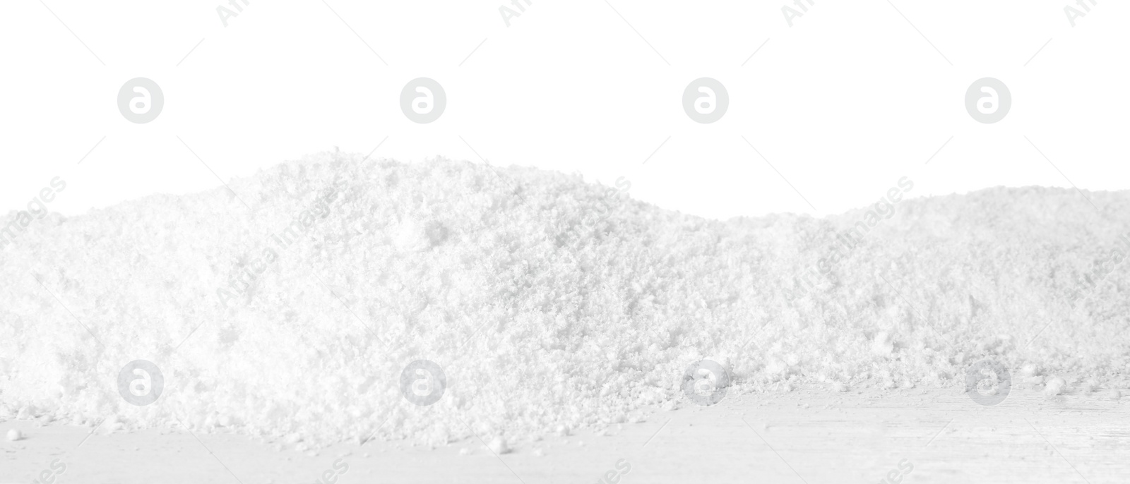 Photo of Snow on wooden table against white background. Christmas season