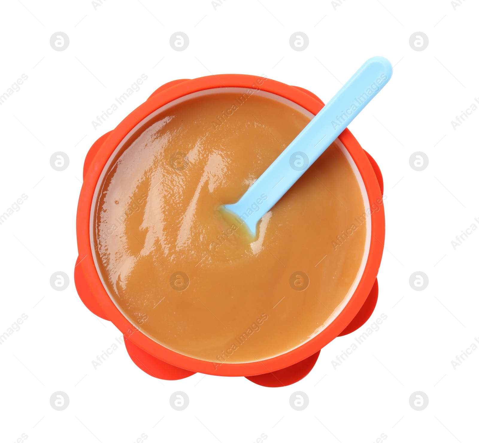 Photo of Tasty baby food and spoon in bowl isolated on white, top view