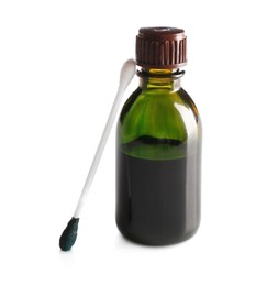 Bottle of brilliant green and cotton bud on white background