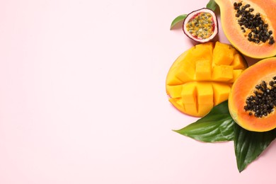 Photo of Fresh ripe papaya and other fruits on pink background, flat lay. Space for text