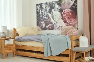 Photo of Stylish teenager's room interior with comfortable bed
