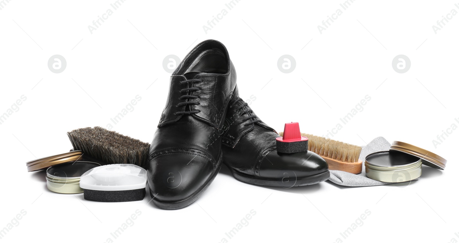 Photo of Stylish men's footwear and shoe care accessories on white background