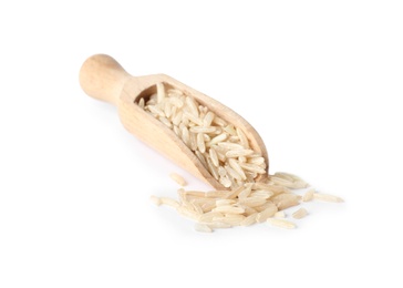 Photo of Scoop with uncooked brown rice on white background