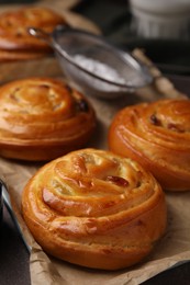 Delicious rolls on table, closeup. Sweet buns