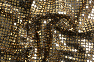 Photo of Golden shiny sequin fabric as background, top view