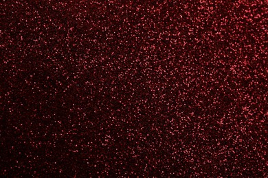 Photo of Beautiful shiny burgundy glitter as background, closeup
