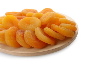 Photo of Wooden tray with tasty dried apricots isolated on white