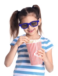 Cute little girl with popcorn and glasses on white background