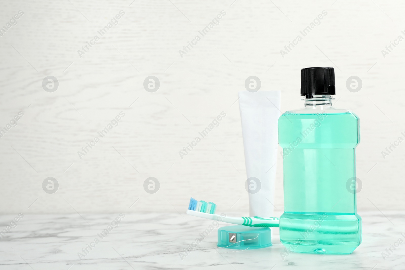 Photo of Oral care products and space for text on light background. Teeth hygiene