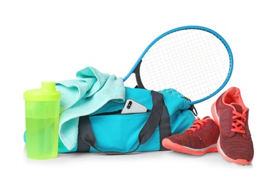 Sports bag and gym equipment on white background