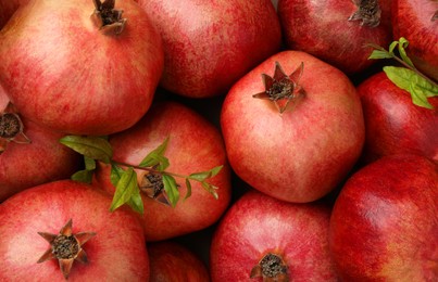 Fresh ripe pomegranates as background, top view