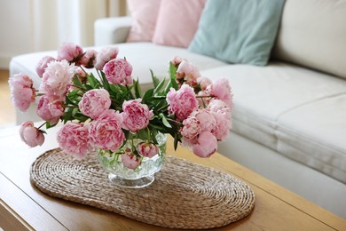 Photo of Beautiful pink peonies in vase on table at home, space for text. Interior design