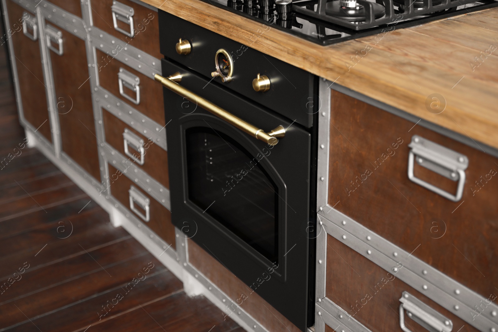 Photo of New modern oven in stylish kitchen. Cooking appliance