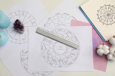 Photo of Zodiac wheels for making forecast of fate and astrological items for fortune telling on table, flat lay
