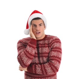 Photo of Surprised man wearing Santa hat on white background
