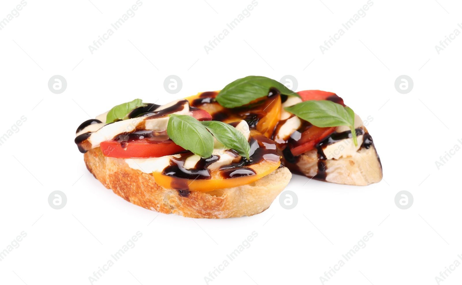 Photo of Delicious bruschettas with mozzarella cheese, tomatoes and balsamic vinegar isolated on white