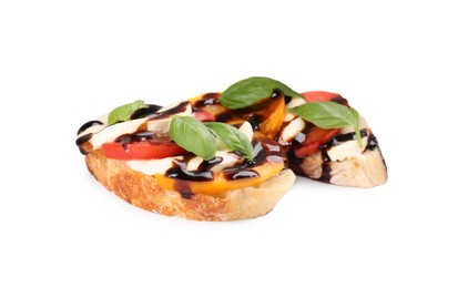 Photo of Delicious bruschettas with mozzarella cheese, tomatoes and balsamic vinegar isolated on white