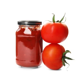 Tasty homemade tomato sauce in glass jar and fresh vegetables on white background