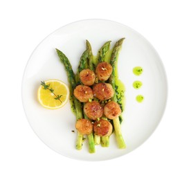 Delicious fried scallops with asparagus, lemon and thyme isolated on white, top view