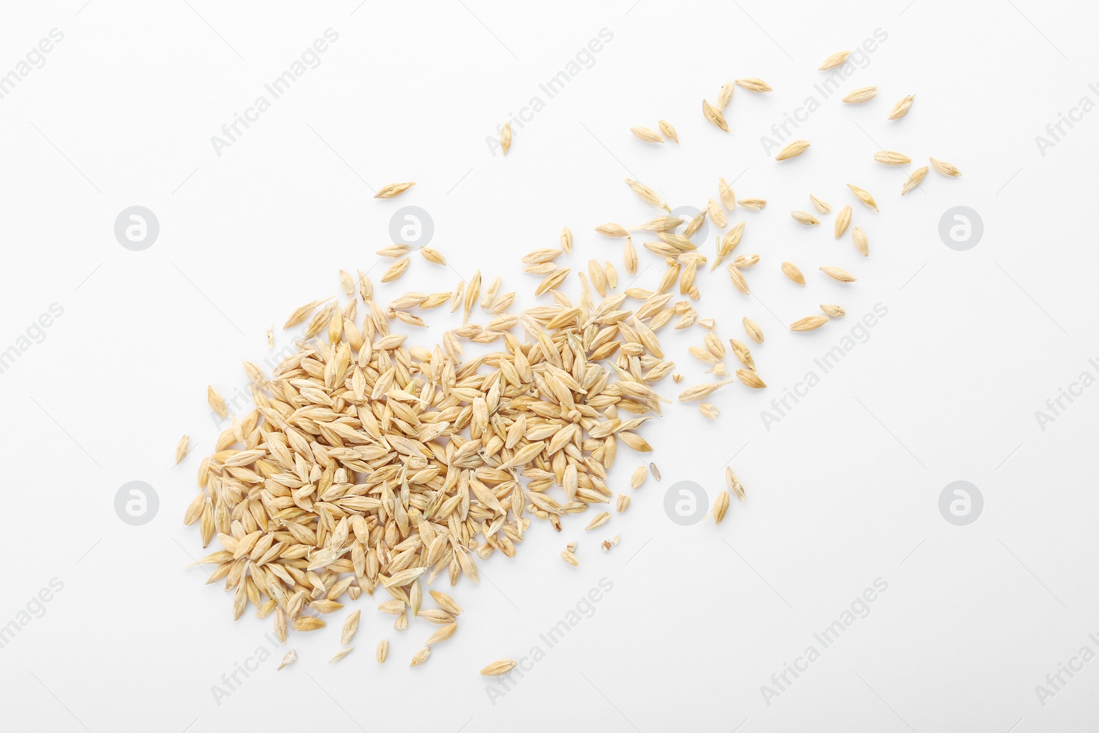 Photo of Raw barley on white background. Healthy grains and cereals