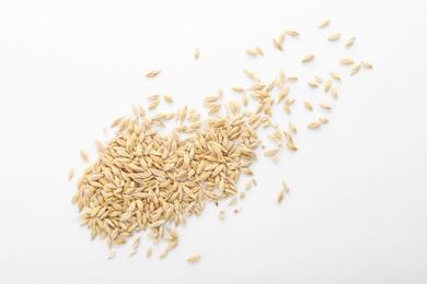 Raw barley on white background. Healthy grains and cereals