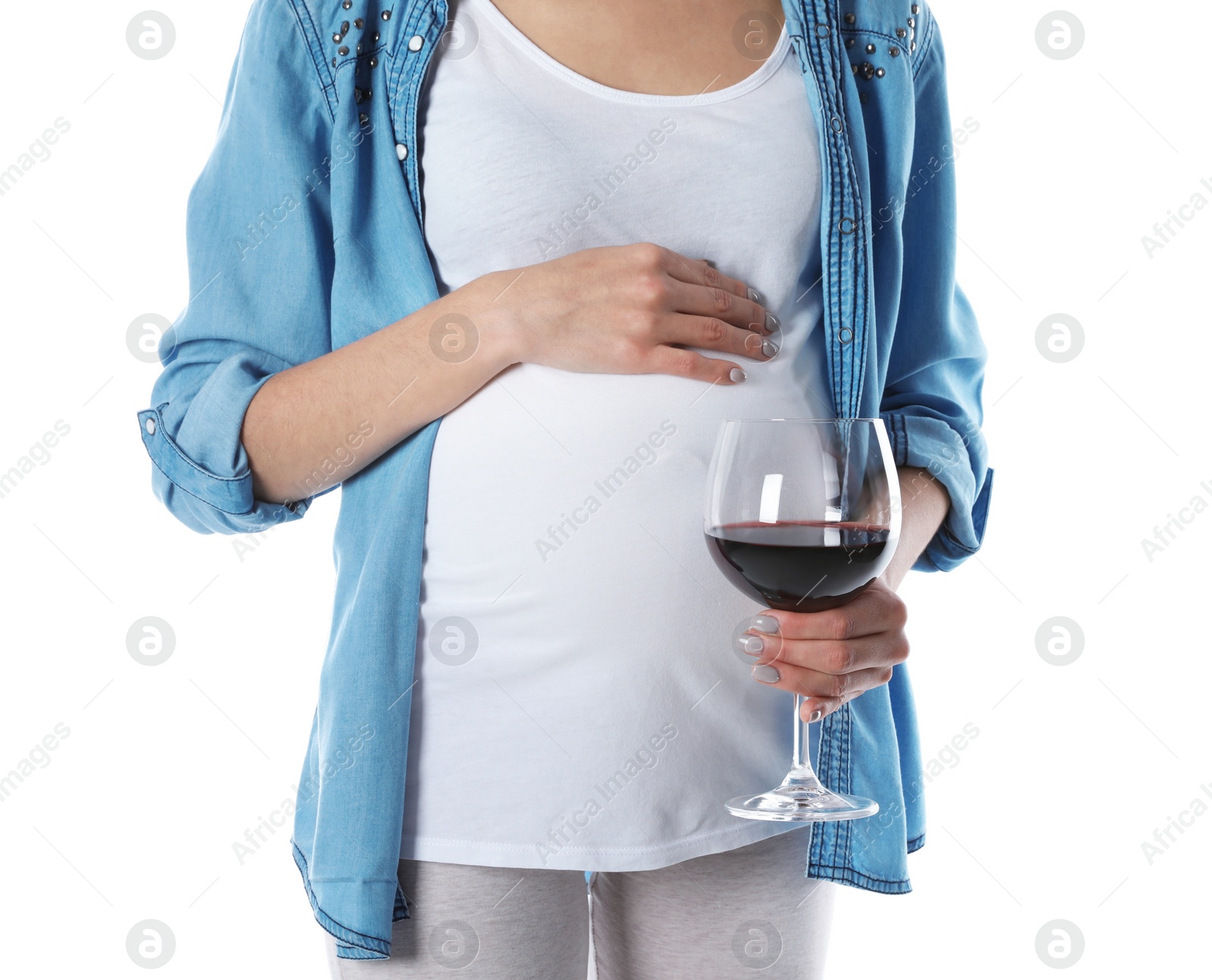 Photo of Future mother with glass of wine on white background, closeup. Alcohol abuse during pregnancy