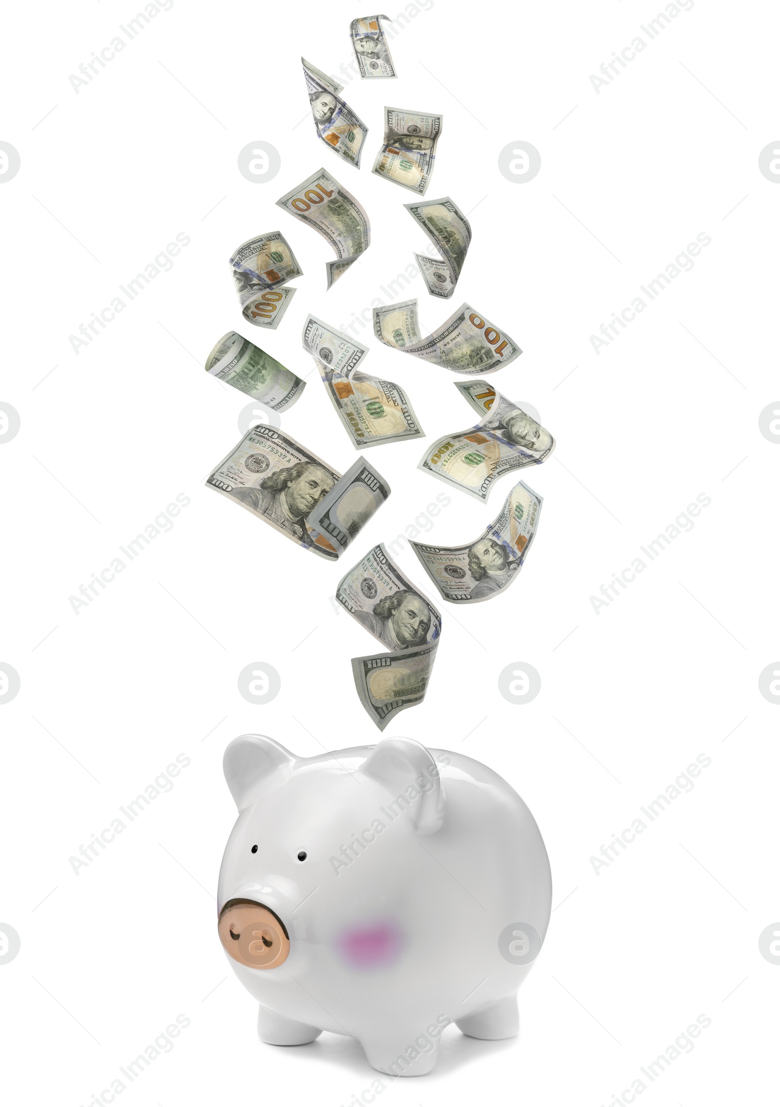 Image of Dollars falling into piggy bank on white background 