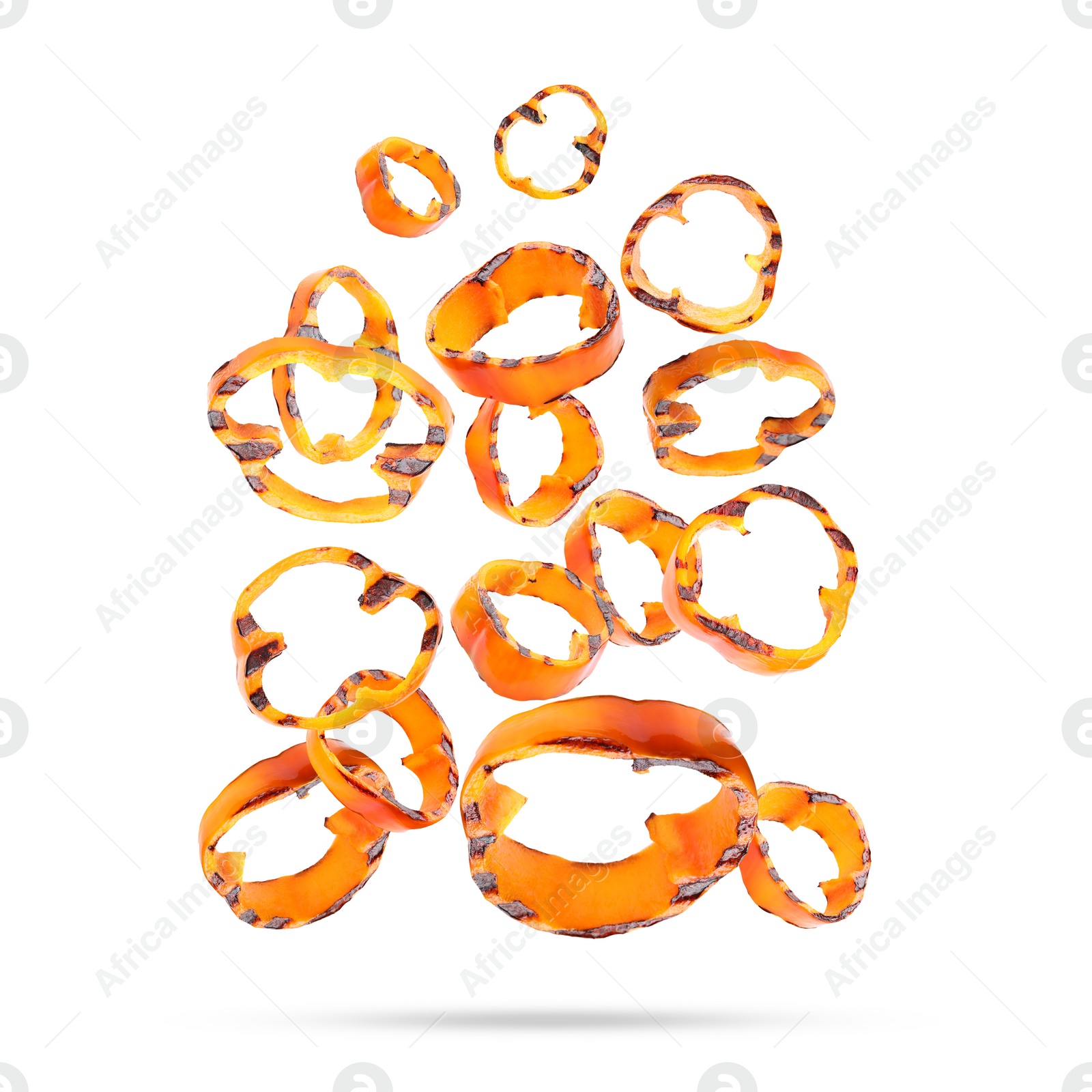 Image of Slices of grilled bell peppers in air on white background