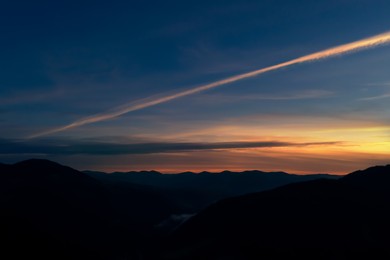 Image of Silhouette of mountain landscape at sunset. Drone photography