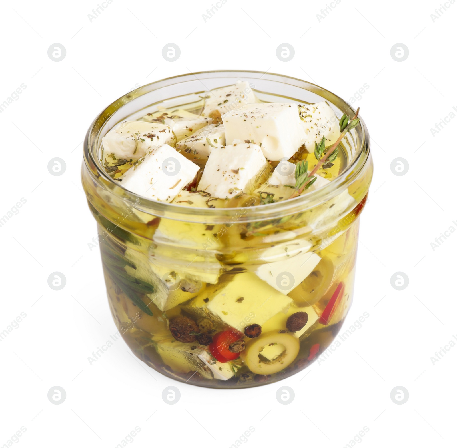 Photo of Open jar with feta cheese marinated in oil on white background. Pickled food