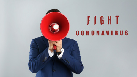 Image of Man in suit with megaphone on grey background. Fighting with coronavirus