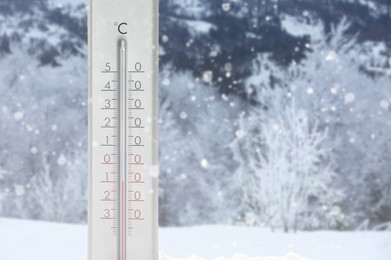 Thermometer showing temperature below zero outdoors on winter day