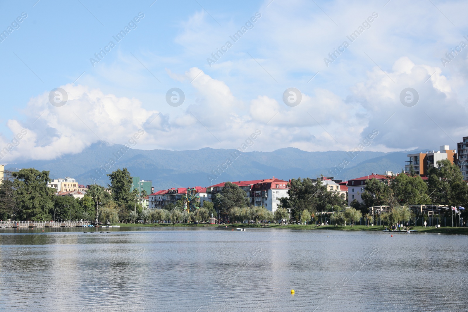 Photo of Batumi, Georgia - October 12, 2022: Picturesque view of city near Nurigeli lake and mountains