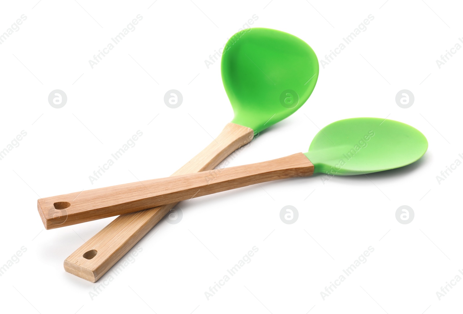 Photo of Spoon and soup ladle with wooden handles on white background