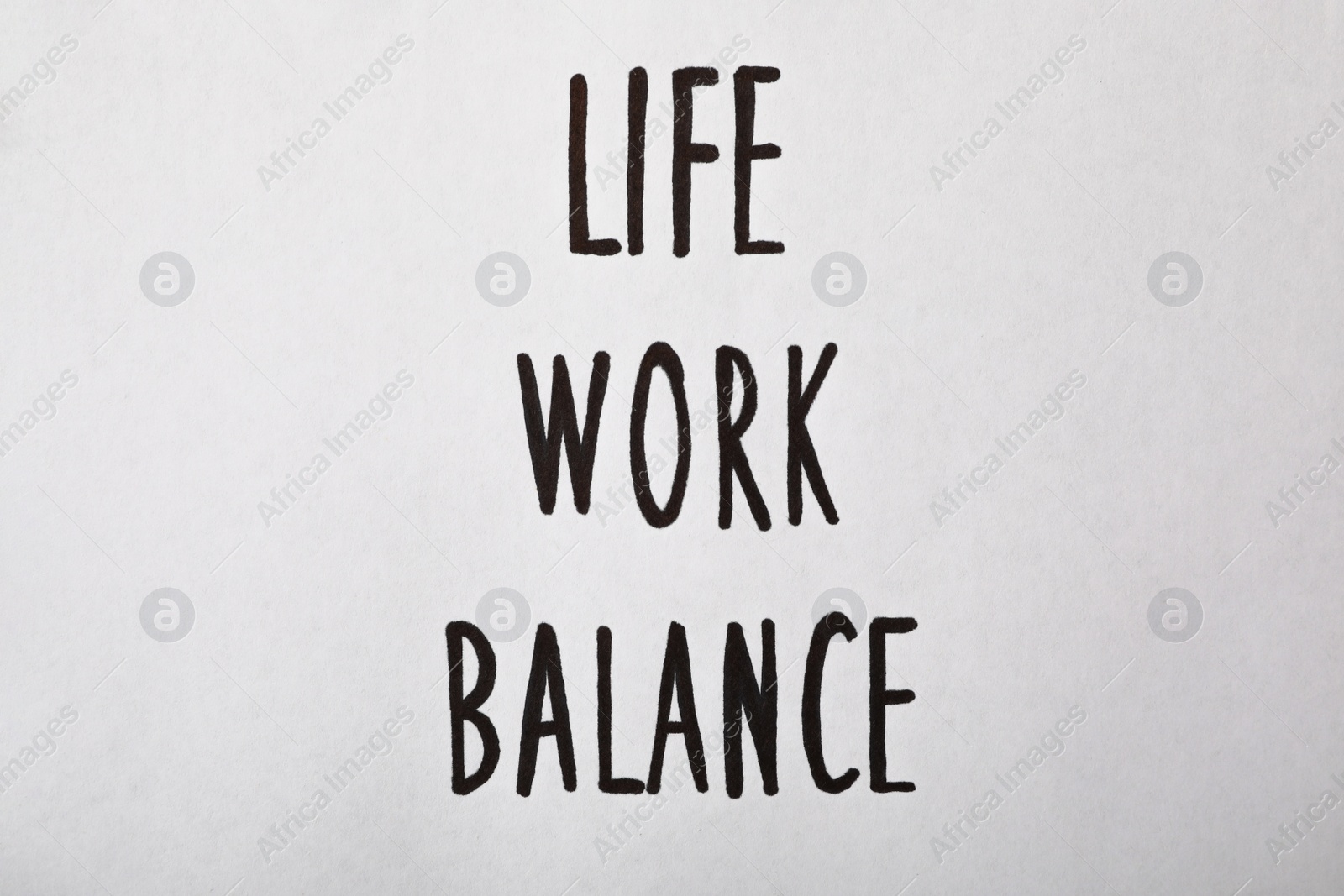 Photo of Life, Work, Balance written on white background, top view