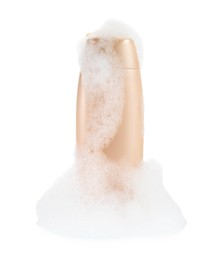 Photo of Bottle of bubble bath with foam isolated on white