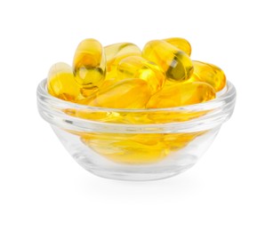 Photo of Vitamin capsules in glass bowl isolated on white