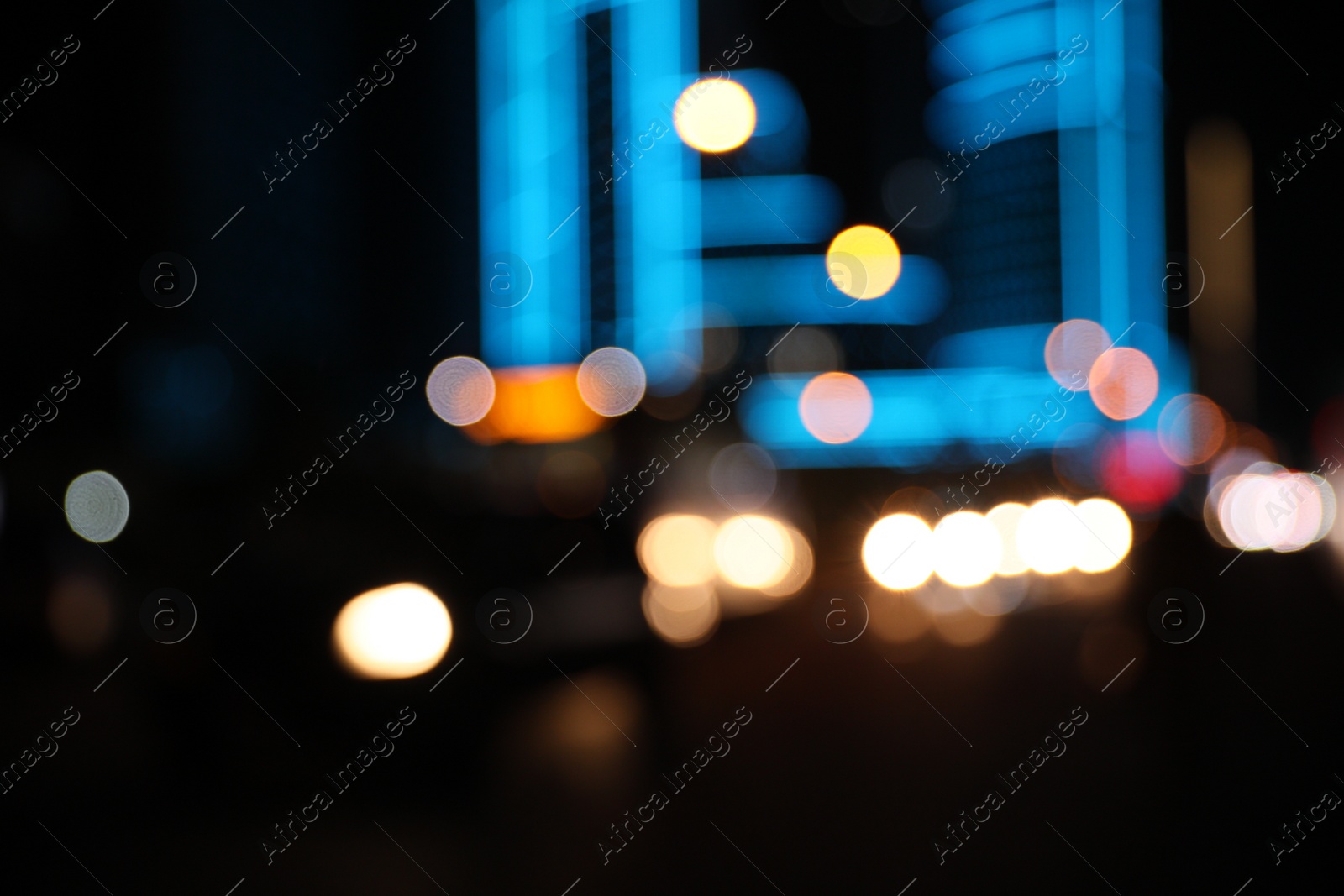 Photo of Blurred view of cityscape with bokeh effect. Night life